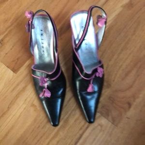 Really cute black pump with pink details.
